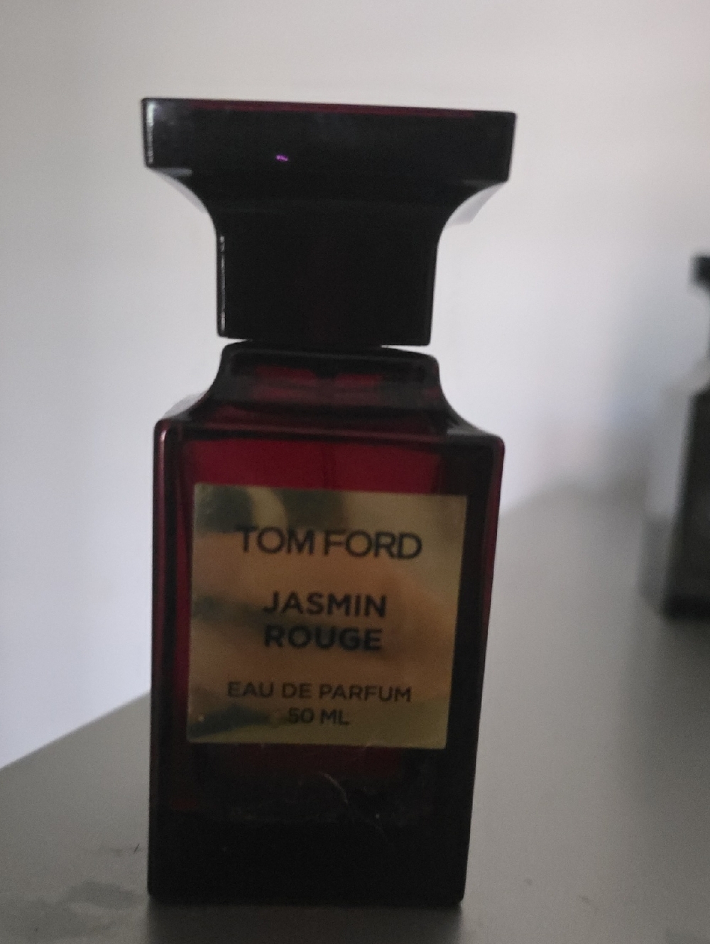 Tom Ford Jasmin Rouge Bottle in Deep Red with Gold Label